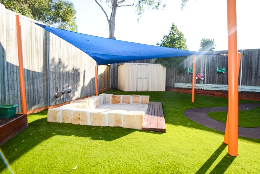 Sandstone and timber sandpit